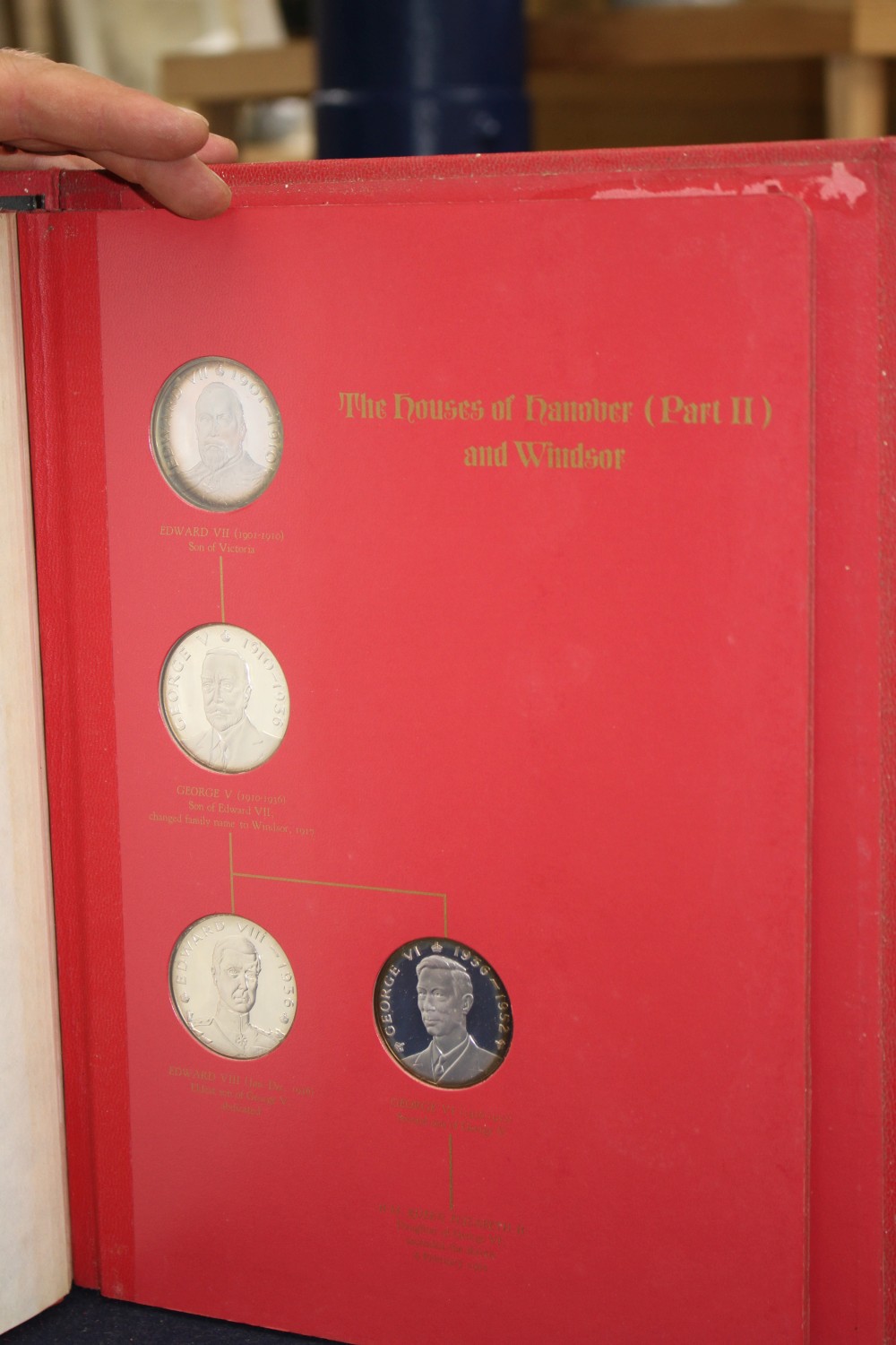 A set of the Kings and Queens of England sterling silver proof medallions, housed in original album and three other cased sets